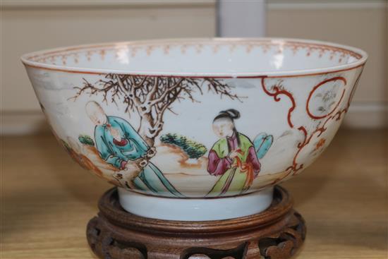 An 18th century Chinese famille rose bowl, wood stand